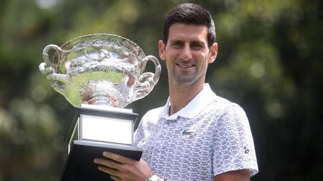 Australian Open champion Serbia's Novak Djokovic poses with the trophy.(REUTERS) Australian Open champion Serbia's Novak Djokovic poses with the trophy.(REUTERS)