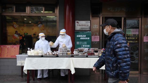 Restaurant workers prepare food to sell on the street in Beijing. Even as policymakers extend preferential loans and introduce tax breaks—among a slew of other measures— authorities “won’t be able to extend life support to all”, said Capital Economics in a report on Wednesday. “The longer the disruptions drag on, the harder it will be to avert significant damage to employment,” it added. (Greg Baker / AFP)
