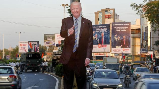 A cut out of US President Donald Trump is seen as cars ply, ahead of Trump's maiden India visit, in Ahmedabad, on Feb. 22, 2020. (PTI) A cut out of US President Donald Trump is seen as cars ply, ahead of Trump's maiden India visit, in Ahmedabad, on Feb. 22, 2020. (PTI)