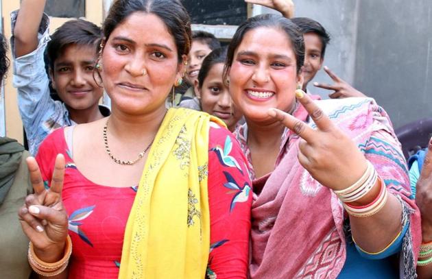 Maya and Rekha, the sisters of Indian Idol winner Sunny, in jubilant mood in Bathinda on Monday. The family is eagerly awaiting the singing sensation’s return.(Sanjeev Kumar/HT)