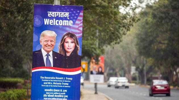 Banners welcoming U.S. President Donald Trump and First Lady Melania Trump hang from posts lining a road ahead of their arrival in New Delhi. (Bloomberg)