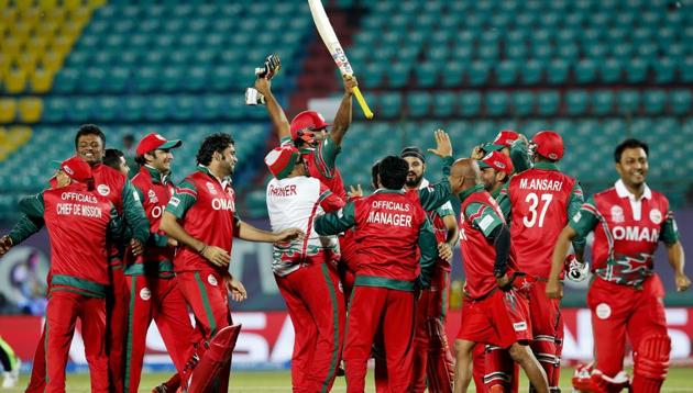 Oman's players celebrate after they won the ICC World Twenty20 2016 cricket tournament against Ireland at the Himachal Pradesh Cricket Association (HPCA) stadium in Dharmsala. (AP)