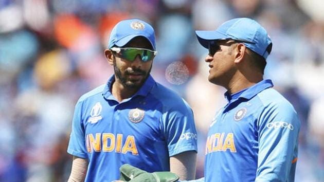 India's Jasprit Bumrah, left, listens to Mahendra Singh Dhoni during the Cricket World Cup match between India and Sri Lanka at Headingley in Leeds.(AP)