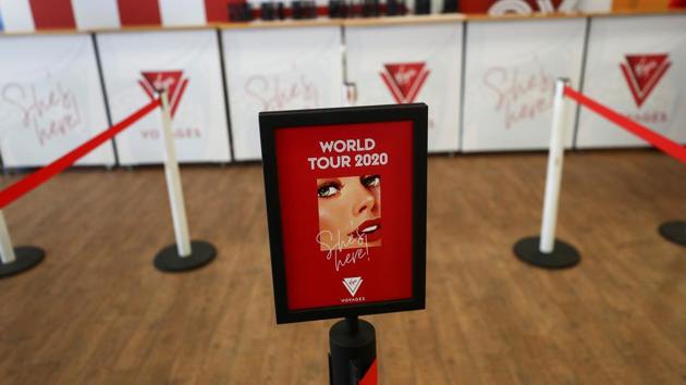 A sign sits at the check-in desk for the Virgin Voyages Scarlet Lady cruise liner at Dover Port. (Simon Dawson / REUTERS) A sign sits at the check-in desk for the Virgin Voyages Scarlet Lady cruise liner at Dover Port. (Simon Dawson / REUTERS)