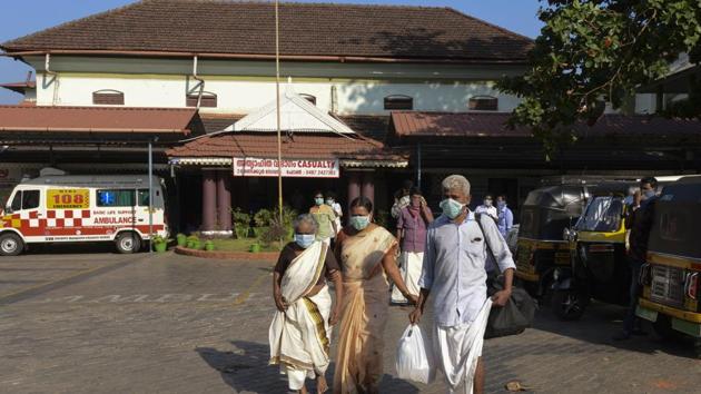 Indians wearing surgical masks walk out of the government general hospital where a student who had been in Wuhan is kept in isolation in Thrissur, Kerala. (AP) Indians wearing surgical masks walk out of the government general hospital where a student who had been in Wuhan is kept in isolation in Thrissur, Kerala. (AP)