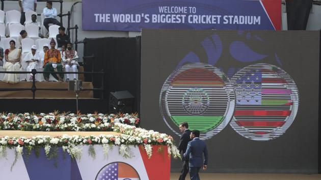 Security officers walk close to the podium where U.S. President Donald Trump and Indian Prime Minister Narendra Modi will be seated at Sardar Patel stadium. (AP)
