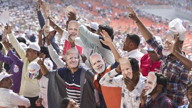 People wearing Prime Minister Narendra Modi and U.S. President Donald Trump’s mask wave as they arrive to attend the ‘Namaste Trump’ event at Sardar Patel Motera Stadium, in Ahmedabad(PTI) People wearing Prime Minister Narendra Modi and U.S. President Donald Trump’s mask wave as they arrive to attend the ‘Namaste Trump’ event at Sardar Patel Motera Stadium, in Ahmedabad(PTI)