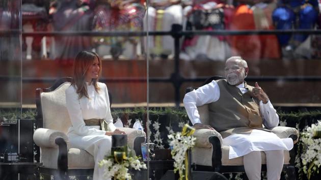 Indian Prime Minister Narendra Modi shares a laugh with First Lady Melania Trump as U.S. President Donald Trump speaks at Sardar Patel Stadium. (AP)