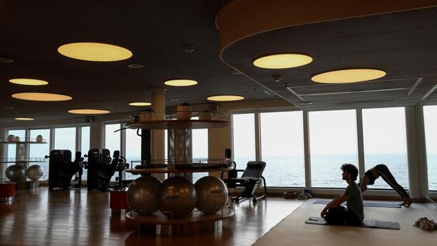 People do yoga at a gym on the Virgin Voyages Scarlet Lady. Single-use plastics are banned, and it is shunning buffets, leading to less food waste as well as avoiding the “staid” imagine of formal cruise dining. (Simon Dawson / REUTERS) People do yoga at a gym on the Virgin Voyages Scarlet Lady. Single-use plastics are banned, and it is shunning buffets, leading to less food waste as well as avoiding the “staid” imagine of formal cruise dining. (Simon Dawson / REUTERS)