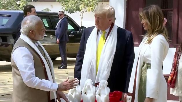 Prime Minister Narendra Modi, US President Donald Trump and First Lady Melania Trump at Sabarmati Ashram in Ahmedabad.