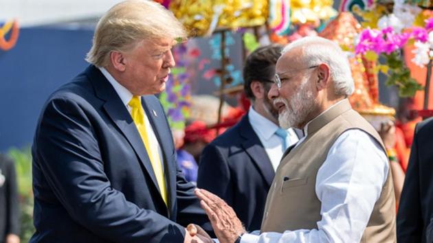 Prime Minister Narendra Modi shakes hand with US President Donald Trump as he receives him at Sardar Patel International Airport, for his two-day state visit to India, in Ahmedabad on Monday.(ANI)