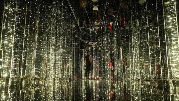 A woman walks through an entrance to a night club on the Virgin Voyages Scarlet Lady. Like other Virgin brands, Branson’s Voyages line will target younger tourists with spas, a gym, 20 restaurants, DJ sets, drag queens and a running track. Children are not allowed. (Simon Dawson / REUTERS) A woman walks through an entrance to a night club on the Virgin Voyages Scarlet Lady. Like other Virgin brands, Branson’s Voyages line will target younger tourists with spas, a gym, 20 restaurants, DJ sets, drag queens and a running track. Children are not allowed. (Simon Dawson / REUTERS)