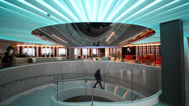 A man walks through the central atrium on the Virgin Voyages Scarlet Lady. The Scarlet Lady will host 2,770 passengers and 1,160 crew. She will sail to Liverpool and then to New York and Miami before her inaugural passenger voyage around the Caribbean in April. (Simon Dawson / REUTERS) A man walks through the central atrium on the Virgin Voyages Scarlet Lady. The Scarlet Lady will host 2,770 passengers and 1,160 crew. She will sail to Liverpool and then to New York and Miami before her inaugural passenger voyage around the Caribbean in April. (Simon Dawson / REUTERS)
