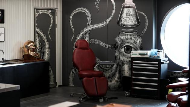 The Squid Ink Tattoo parlour is seen on the Virgin Voyages Scarlet. Virgin Voyages says it is one of the first cruise lines to use Climeon, a technology that generates electricity from the heat of the ship’s engine to reduce demand for fuel, and will also purchase carbon offsets. (Simon Dawson / REUTERS) The Squid Ink Tattoo parlour is seen on the Virgin Voyages Scarlet. Virgin Voyages says it is one of the first cruise lines to use Climeon, a technology that generates electricity from the heat of the ship’s engine to reduce demand for fuel, and will also purchase carbon offsets. (Simon Dawson / REUTERS)
