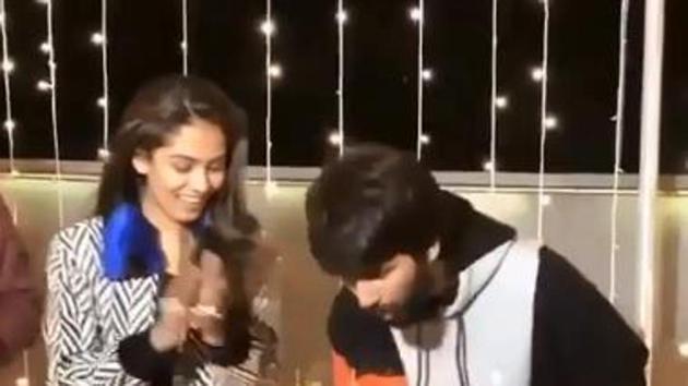 Shahid Kapoor cuts a cake to celebrate his 39th birthday as wife Mira Rajput looks on.