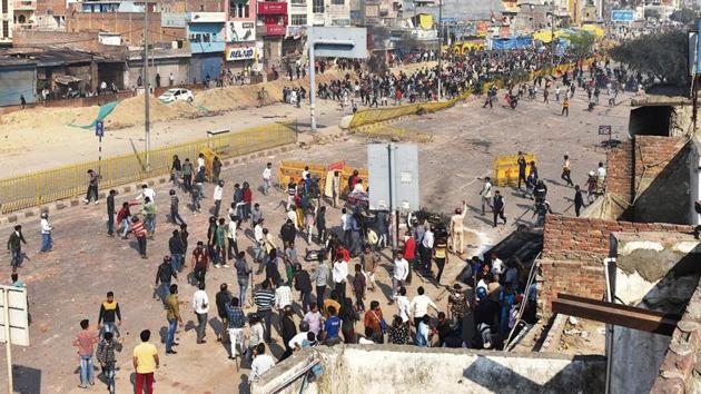 Pro- and anti-CAA demonstrators clash on the Bhajanpura main road on Monday. Violence throughout the day in the area left five dead and at least 75 persons injured.(Sanchit Khanna/HT PHOTO) Pro- and anti-CAA demonstrators clash on the Bhajanpura main road on Monday. Violence throughout the day in the area left five dead and at least 75 persons injured.(Sanchit Khanna/HT PHOTO)