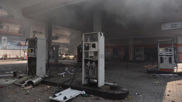 A petrol station seen burnt after clashes between anti and pro CAA demonstrations at Bhajanpura. Home ministry officials familiar with the matter said the clashes seemed to have been orchestrated to coincide with the high-profile visit, although home secretary Ajay Bhalla refused to speculate on the issue. He said the situation was under control. “Sufficient forces have been deployed; senior officers are in the field,” he told reporters. (Sanchit Khanna / HT Photo)