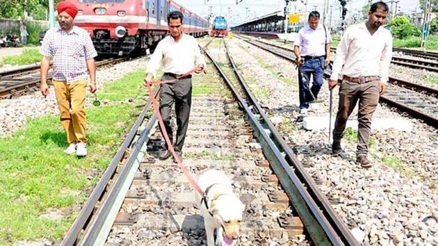Anti-bomb squad searching rail tracks near Jalandhar railway station on Tuesday. (Pardeep Pandit/HT Photo)