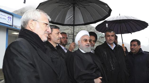 President Hassan Rouhani, center, sought to reassure the nation in a speech on Tuesday (Feb 25th, 2020), calling the new coronavirus an "uninvited and inauspicious passenger." "We will get through corona," Rouhani said. "We will get through the virus."(AP)