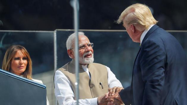 US President Donald Trump and Indian Prime Minister Narendra Modi shake hands, as First lady Melania Trump looks on, at a "Namaste Trump" event.(Photo: Reuters)