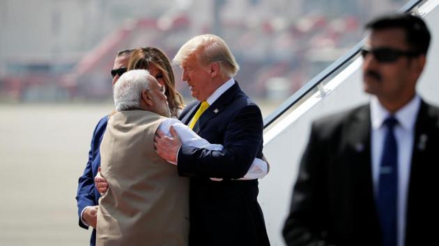 US President Donald Trump greets Indian Prime Minister Narendra Modi as he arrives at Sardar Vallabhbhai Patel International airport in Ahmedabad.(REUTERS)