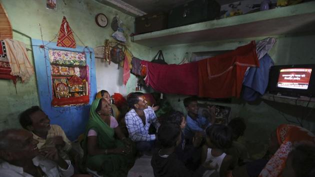 Hindus applaud as they sit together to watch the verdict in a decades-old land title dispute in Ayodhya (File photo: AP) Hindus applaud as they sit together to watch the verdict in a decades-old land title dispute in Ayodhya (File photo: AP)