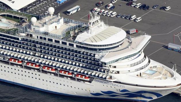 The US-operated Diamond Princess is anchored as emergency vehicles stand by at Yokohama Port, near Tokyo, Wednesday, Feb. 12, 2020.(AP)