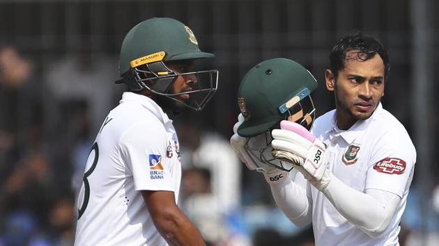Bangladesh's Mushfiqur Rahim, right, and Mehidy Hasan stand between the wickets during the third day of first cricket test match between India and Bangladesh in Indore.(AP) Bangladesh's Mushfiqur Rahim, right, and Mehidy Hasan stand between the wickets during the third day of first cricket test match between India and Bangladesh in Indore.(AP)