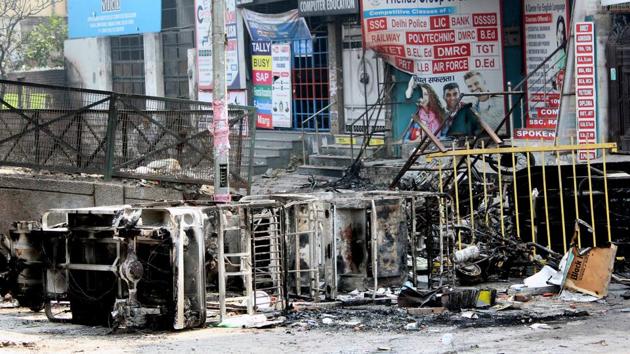 Burnt vehicles northeast Delhi’s Chand Bagh as protest over CAA turned violent for the third consecutive day on Wednesday.(WASIM/SARVAR/HT PHOTO)