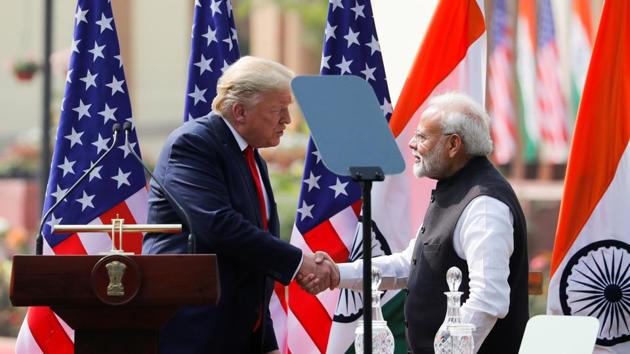 US President Donald Trump and Prime Minister Narendra Modi shake hands during a joint news conference after bilateral talks at Hyderabad House in New Delhi on Tuesday.(Reuters Photo)
