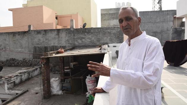 “You cannot walk anywhere in the village without sniffing the pungent odour of the fumes from the jet engines. People living in houses along the airport wall people find it hard to sleep. The trouble comes not just from the skies, but also from underground (where the Metro’s Airport Experess Line runs),” says Satyadev Solanki, a resident. (Vipin Kumar / HT Photo)