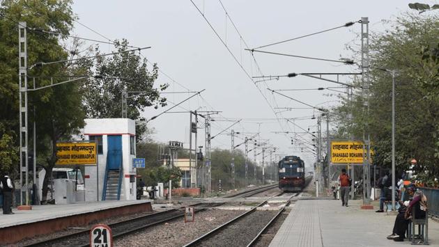 Shahbad Mohammadpur is among the few villages in Delhi to have a railway station. It has been in service since 1971. About 80 trains pass through the station through the day, with about 11 passenger trains halting at the station.“On an average three trains per hour, both passenger and goods, pass through the station,” says Karan Singh, a ticket supervisor at the station. (Vipin Kumar / HT Photo)