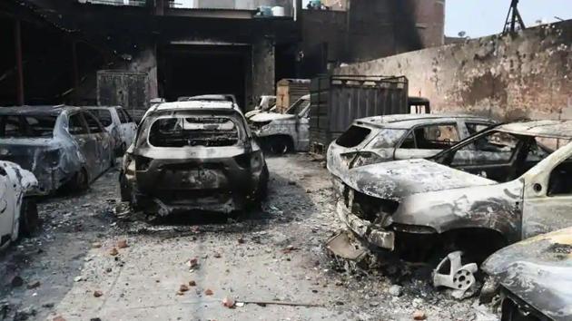 Burnt vehicles after clashes between opposing groups over the Citizenship Amendment Act (CAA) at Karawal Nagar in New Delhi, India, on Wednesday, February 26, 2020.(Biplov Bhuyan/HT PHOTO)