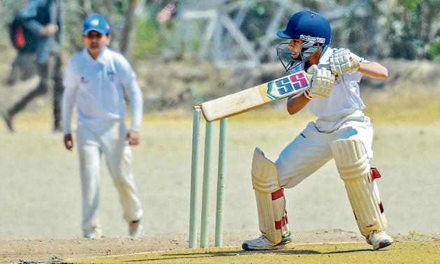 Yash Adhikari of Abhinava Vidyalaya in action against Kline Memorial School during the PDCA u14 interschool tournament at the Fergusson College grounds on Wednesday.(MILIND SAURKAR/HT)