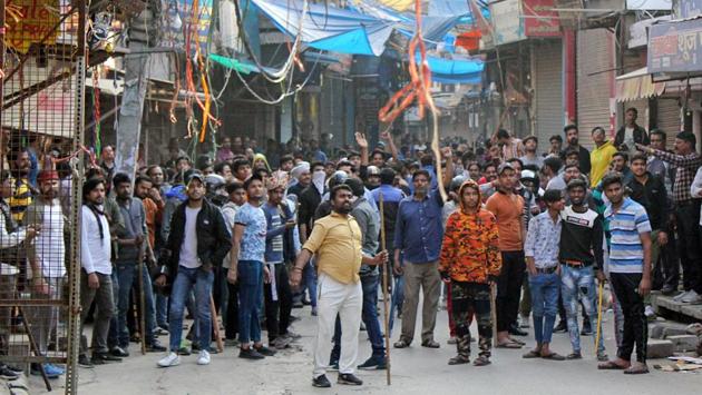 Protesters are seen at Khajuri Khas, in New Delhi. After the meeting, Kejriwal said all political parties will ensure that normalcy returns to the city. “Everyone wants that the violence be stopped,” he said, striking an amicable tone in the wake of a political blame game over the clashes. It was also decided at the meeting that peace committees should be reactivated in all localities. (WASIM/SARVAR / HT Photo)