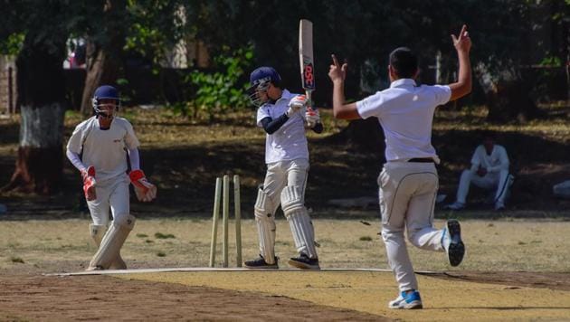 New English School (Shaniwar Peth) batsman clean bowled in the match against Vibgyor School (Balewadi) at Law college ground on Tuesday.(SANKET WANKHADE/HT)