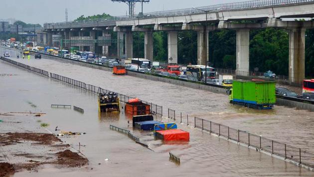Motorists are seen trapped on a flooded toll road after heavy rain in Bekasi. State electricity utility Perusahaan Listrik Negara (PLN) said power was shut off to more than 1,600 substations to ensure safety. (REZAS / AFP)