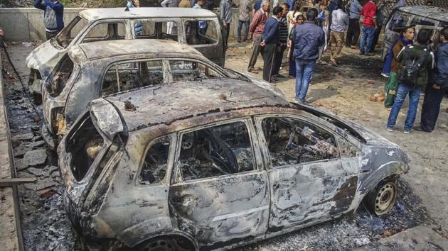 The vehicles which were set ablaze by rioters in Northeast Delhi on Wednesday.(PTI Photo)