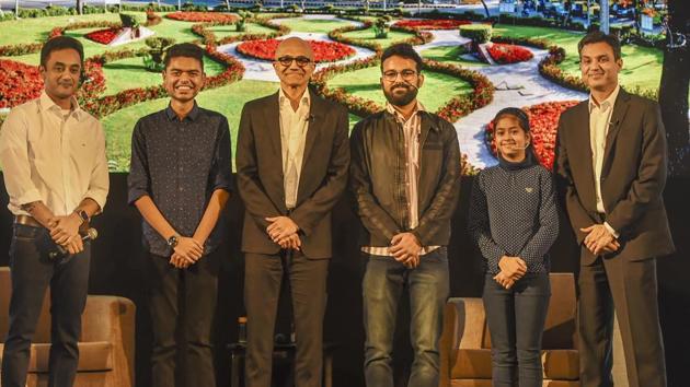 Microsoft CEO Satya Nadella(3rd L) poses for a group photograph with Namya Joshi and other students.(PTI)