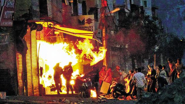 New Delhi: Rioters set ablaze a shop during clashes between those against and those supporting the Citizenship (Amendment) Act in at Gokalpuri in north east Delhi, Tuesday, Feb. 25, 2020.(PTI)