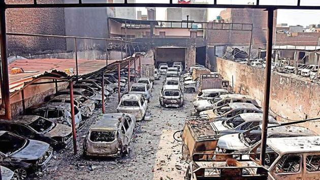 A view of burnt vehicles which were set ablaze by demonstrators following clashes between two groups over the new citizenship law, at Shiv Vihar Tiraha in New Delhi.(Photo: ANI) A view of burnt vehicles which were set ablaze by demonstrators following clashes between two groups over the new citizenship law, at Shiv Vihar Tiraha in New Delhi.(Photo: ANI)