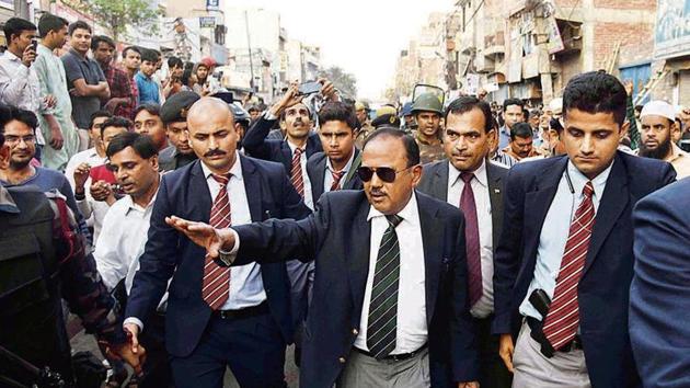 National Security Advisor (NSA) Ajit Doval interacts with local residents at violence affected areas in Maujpur.(HT Photo)