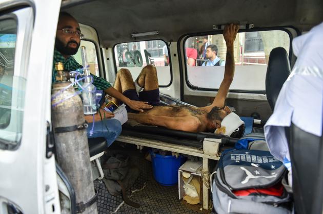 A man injured during communal violence over the amended citizenship law in the riot-affected north east Delhi, being brought to GTB hospital for treatment, in east Delhi. (PTI) A man injured during communal violence over the amended citizenship law in the riot-affected north east Delhi, being brought to GTB hospital for treatment, in east Delhi. (PTI)
