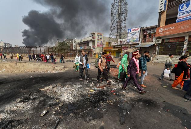 A bridegroom along with relatives heads for his wedding as they walk past Bhagirathi Vihar area of the riot-affected north-east Delhi, February 26, 2020(PTI)