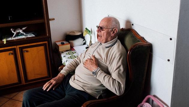 Gino Verani sits at home in San Fiorano. Verani is upset because the local bar is closed. “We told my grandpa 100 times that the bar is not open because of the Spanish flu, to make him understand,” primary school teacher Marzio Toniolo told Reuters, referring to the deadly disease that killed millions after World War One and remains a byword for pandemics. “He is very angry and very old,” he added. (Marzio Toniolo / REUTERS)