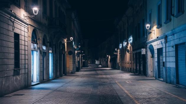 An empty street at night is seen in San Fiorano, one of the towns on lockdown due to a coronavirus outbreak. San Fiorano is some 70km from Italy’s financial capital Milan, and has effectively been closed off from the outside world along with nine neighbouring towns that were the epicentre of the coronavirus outbreak. (Marzio Toniolo / REUTERS)