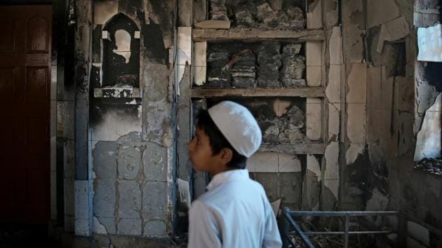 An Indian Muslim boy stands inside a mosque burnt in Tuesday's violence in New Delhi, India, Thursday, Feb. 27, 2020. (AP photo) An Indian Muslim boy stands inside a mosque burnt in Tuesday's violence in New Delhi, India, Thursday, Feb. 27, 2020. (AP photo)