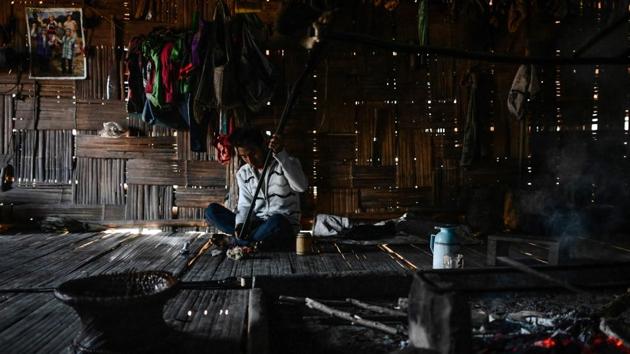 A Naga tribesman checks an old hunting rifle at his home at a village in Sagaing. This region is one of the poorest corners of Myanmar, where many must walk for days to reach the nearest town, few children progress beyond primary school education and only 40 percent of villages boast electricity. (Ye Aung Thu / AFP)
