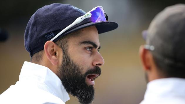 India captain Virat Kohli speaking with teammates during the a Test match.(REUTERS)