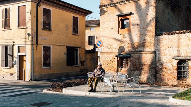 Gino Verani, 87, sits a table in a piazza in San Fiorano, one of the towns on lockdown due to a coronavirus outbreak. Some 50,000 people are under quarantine as Italy tries to contain Europe’s worst outbreak of coronavirus that flared up in the regions of Lombardy and Veneto. (Marzio Toniolo / REUTERS)